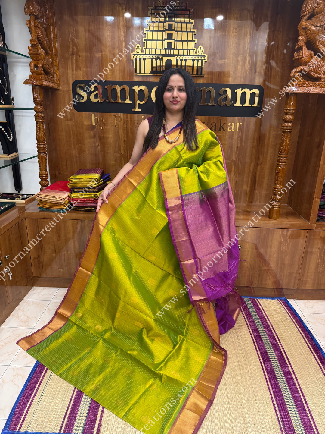 Light Green with Magenta  , rich Zari checks in the body , Mayil and Chakram rich butta in the body , traditional border rich Pallu Silk Cotton Saree