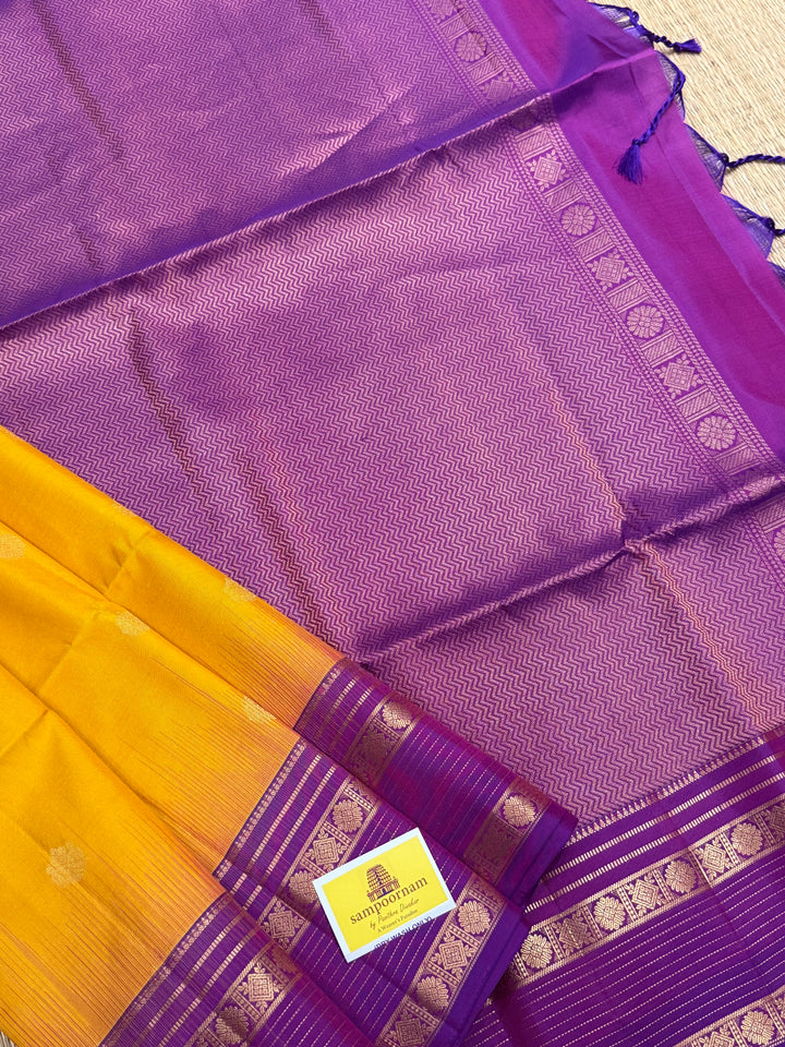 A classic Manjal with Purple, Rich Butta in the Body, Rettapet Traditional Borders and Grand Pallu Pure Soft Silk Saree