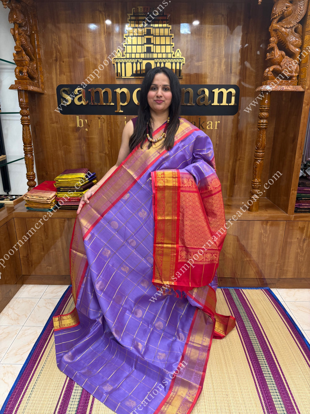 Lilac with Red  , rich Zari checks in the body , Mayil and Chakram rich butta in the body , traditional border rich Pallu Silk Cotton Saree
