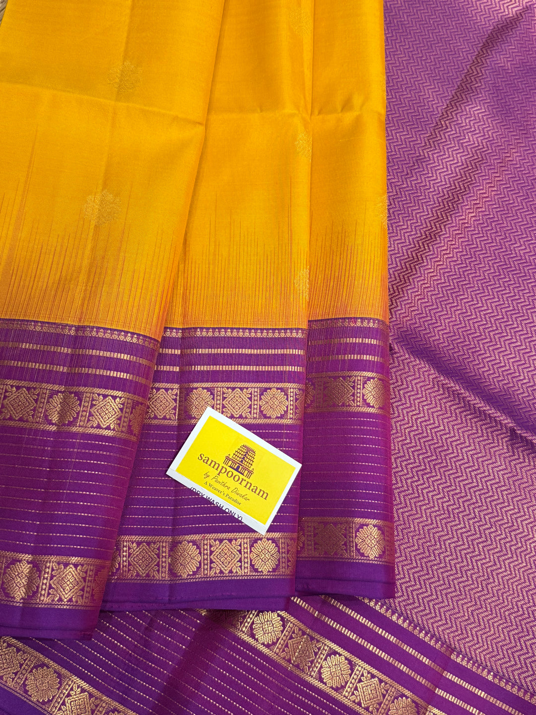 A classic Manjal with Purple, Rich Butta in the Body, Rettapet Traditional Borders and Grand Pallu Pure Soft Silk Saree