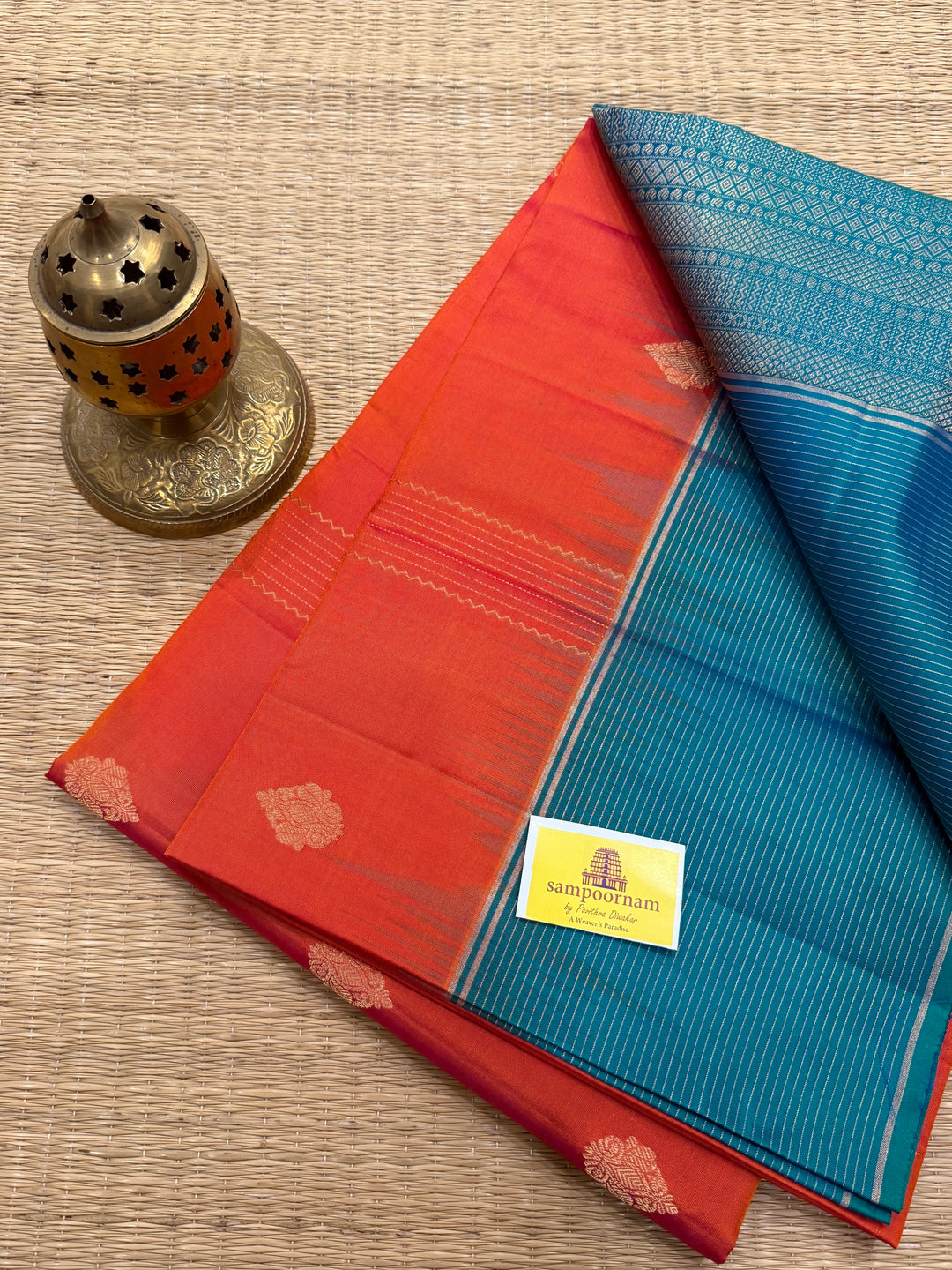 Orangish Red with Turquoise Blue, Vertical Silver and Fold Zari Lines with Rich Butta in the body and Grand Pallu Pure Soft Silk Saree