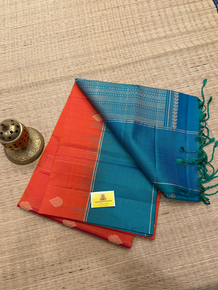 Orangish Red with Turquoise Blue, Vertical Silver and Fold Zari Lines with Rich Butta in the body and Grand Pallu Pure Soft Silk Saree