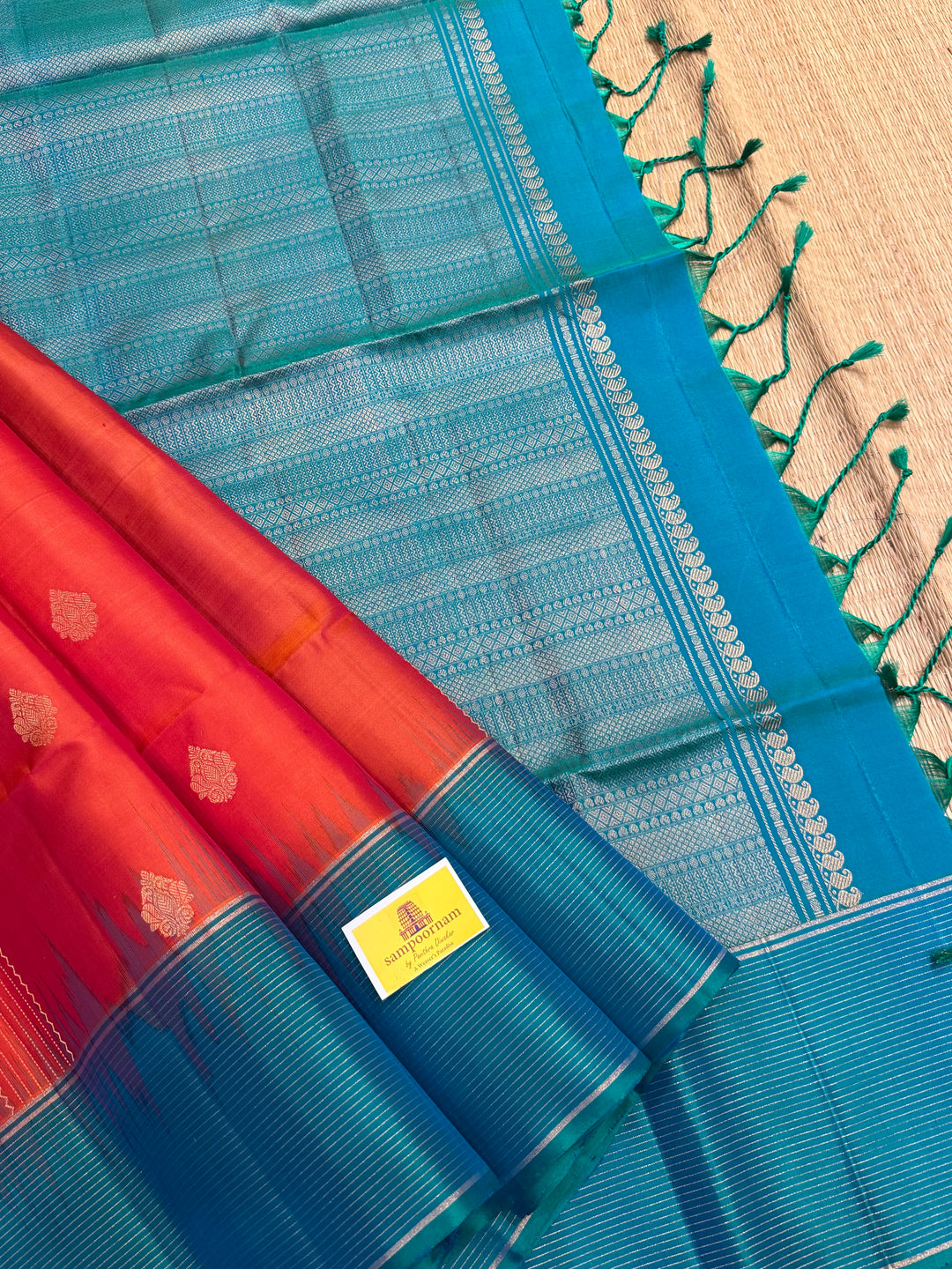 Orangish Red with Turquoise Blue, Vertical Silver and Fold Zari Lines with Rich Butta in the body and Grand Pallu Pure Soft Silk Saree