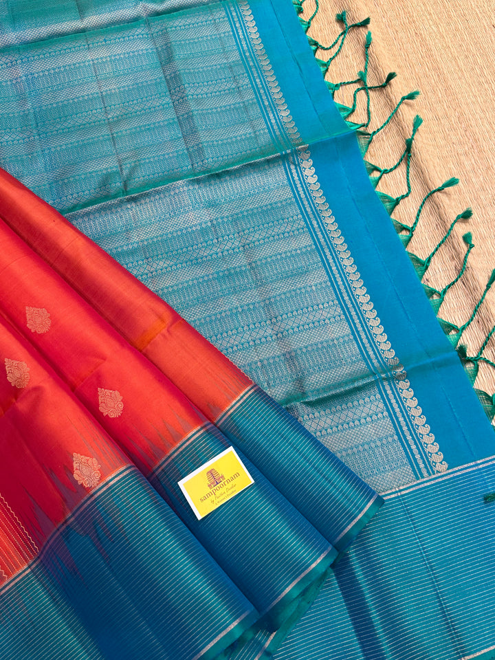 Orangish Red with Turquoise Blue, Vertical Silver and Fold Zari Lines with Rich Butta in the body and Grand Pallu Pure Soft Silk Saree