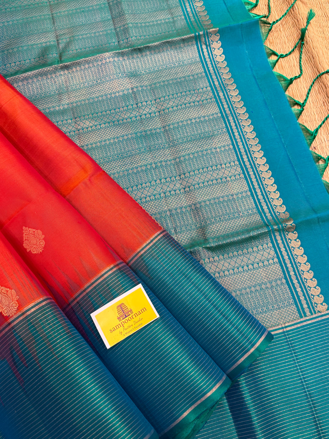 Orangish Red with Turquoise Blue, Vertical Silver and Fold Zari Lines with Rich Butta in the body and Grand Pallu Pure Soft Silk Saree