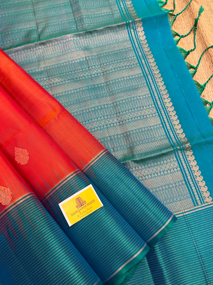 Orangish Red with Turquoise Blue, Vertical Silver and Fold Zari Lines with Rich Butta in the body and Grand Pallu Pure Soft Silk Saree