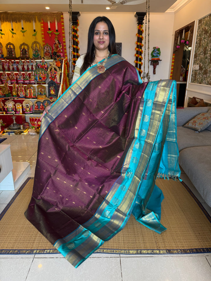 Dark Wine with Turquoise Blue , one side big satin border with Annam motifs , fine Zari checks in the body and rich Pallu Korvai Silk Cotton Saree