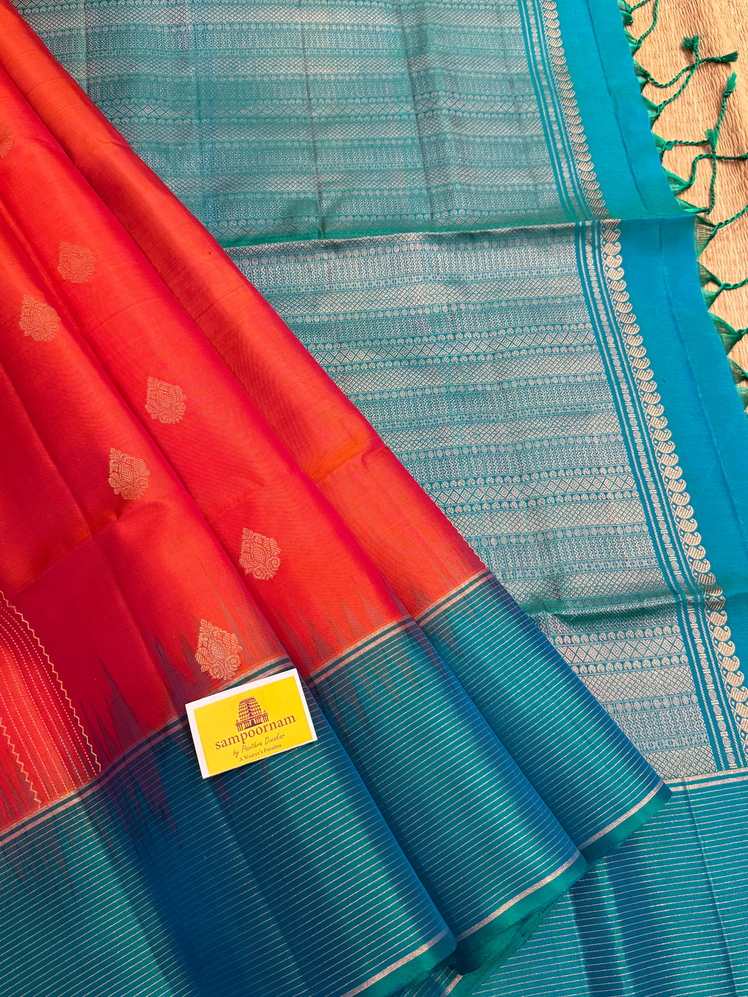 Orangish Red with Turquoise Blue, Vertical Silver and Fold Zari Lines with Rich Butta in the body and Grand Pallu Pure Soft Silk Saree
