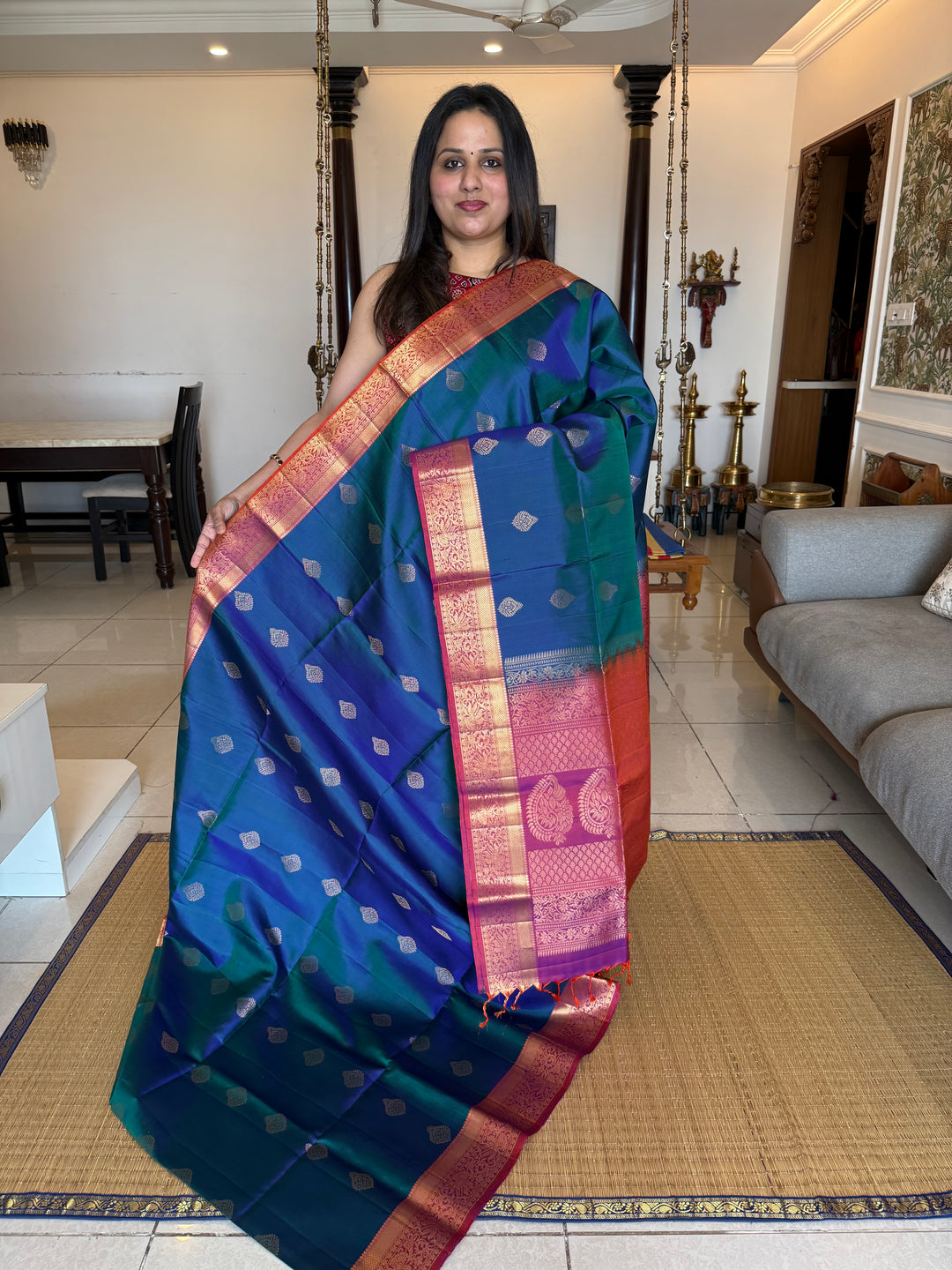 Traditional Mayilkazhuthu Blue with Orangish Pink , Rich Zari Motifs in the Body and Traditional Rich Pallu Pure Soft Silk Saree