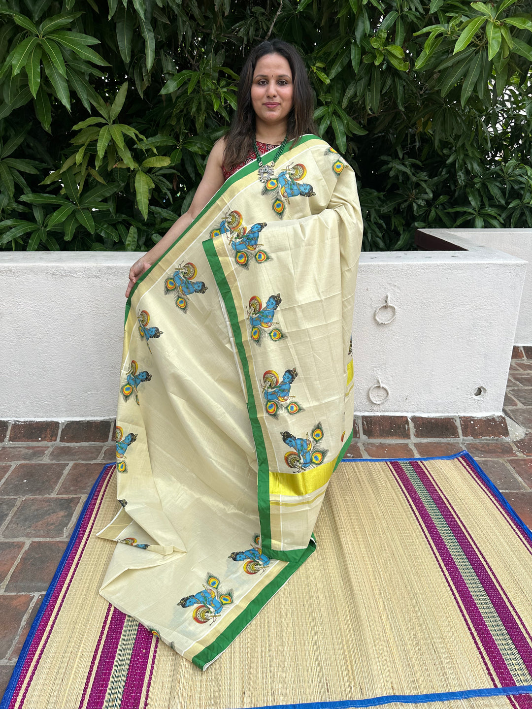 Kerala Tissue Saree with Baby Butter Krishna Motif and Green Piping in Borders