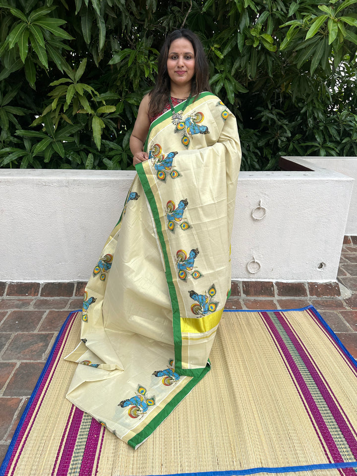 Kerala Tissue Saree with Baby Butter Krishna Motif and Green Piping in Borders