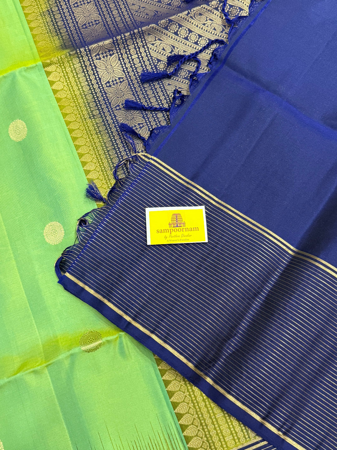 Pastel Green with Blue, Rich annam and chakram butta in the body, Vairaoosi Zari Lines in the border and Grand Pallu Pure Soft Silk Saree