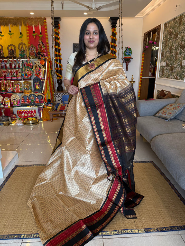 Cream with Black, Lakshadeepam thread butta in the body and silk border with rich Pallu Korvai Silk Cotton Saree