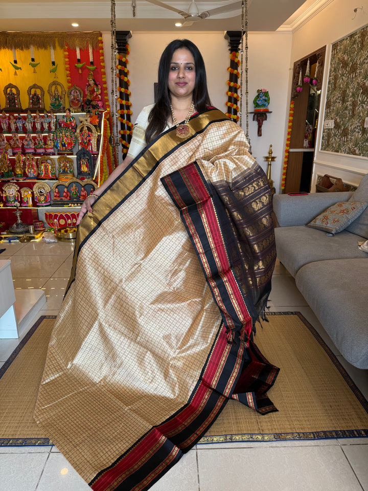 Cream with Black, Lakshadeepam thread butta in the body and silk border with rich Pallu Korvai Silk Cotton Saree