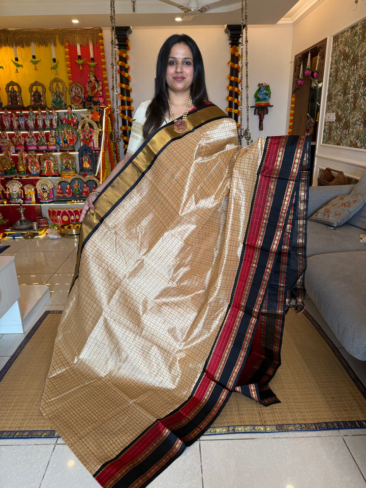 Cream with Black, Lakshadeepam thread butta in the body and silk border with rich Pallu Korvai Silk Cotton Saree