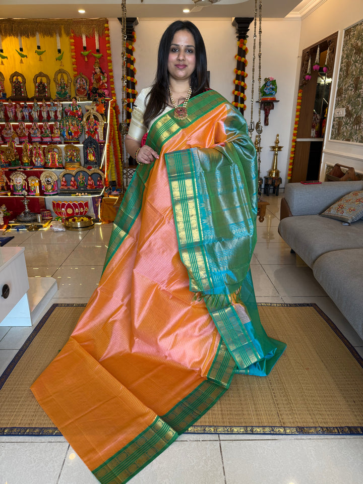 Peach Pink with Sea Green , rich Zari checks in the body ,rettapet border and grand Pallu Korvai Silk Cotton Saree