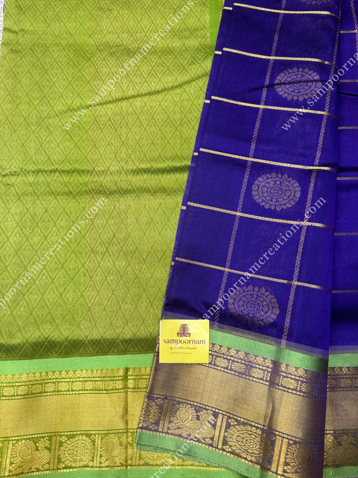 Indigo with Lemon Yellow  , rich Zari checks in the body , Mayil and Chakram rich butta in the body , traditional border rich Pallu Silk Cotton Saree