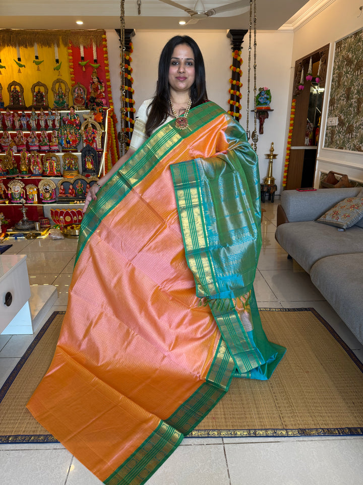 Peach Pink with Sea Green , rich Zari checks in the body ,rettapet border and grand Pallu Korvai Silk Cotton Saree