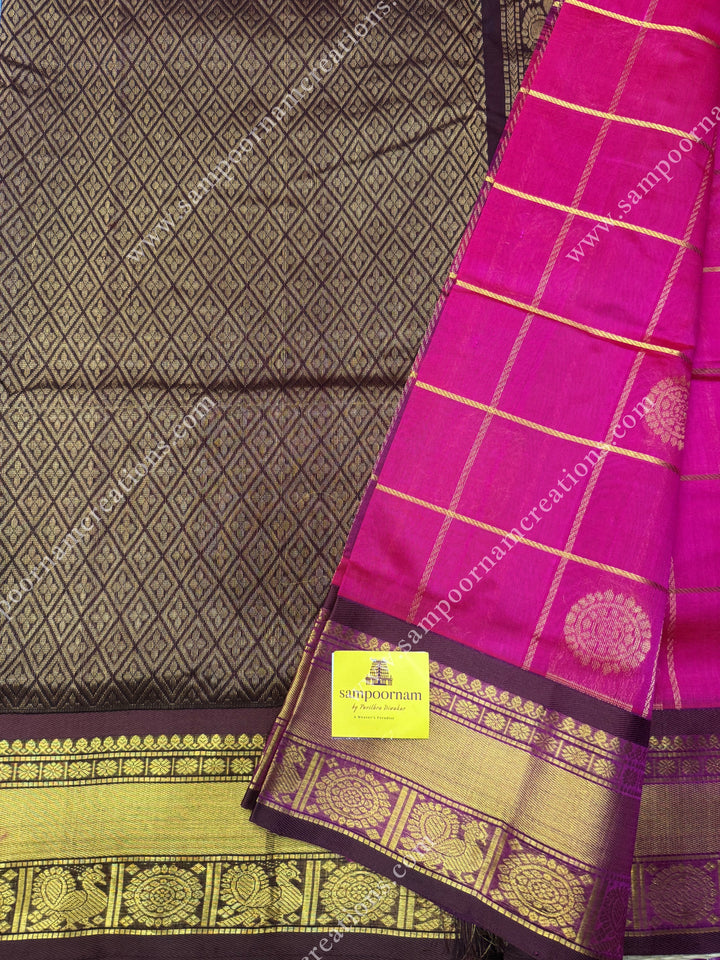 Rani Pink with Brown , rich Zari checks in the body , Mayil and Chakram rich butta in the body , traditional border rich Pallu Silk Cotton Saree