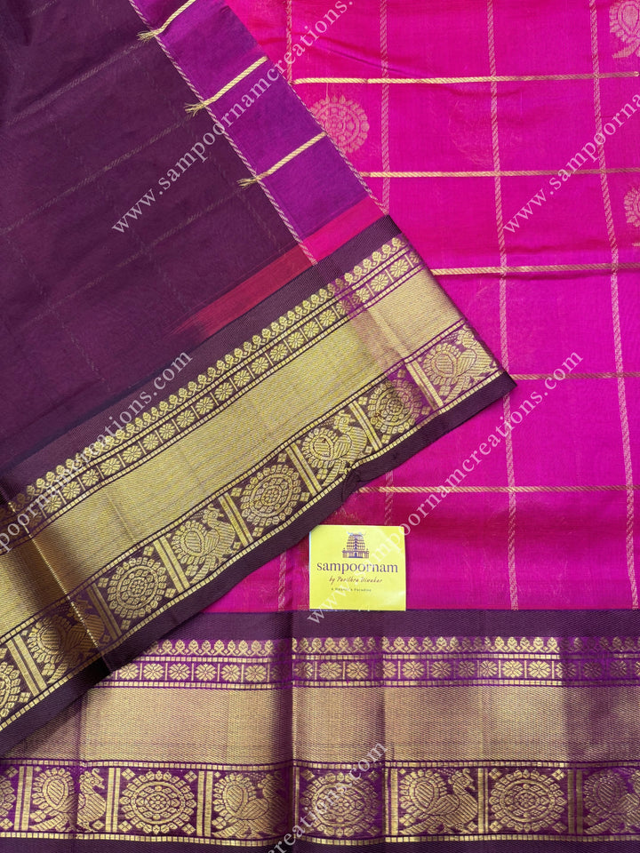 Rani Pink with Brown , rich Zari checks in the body , Mayil and Chakram rich butta in the body , traditional border rich Pallu Silk Cotton Saree