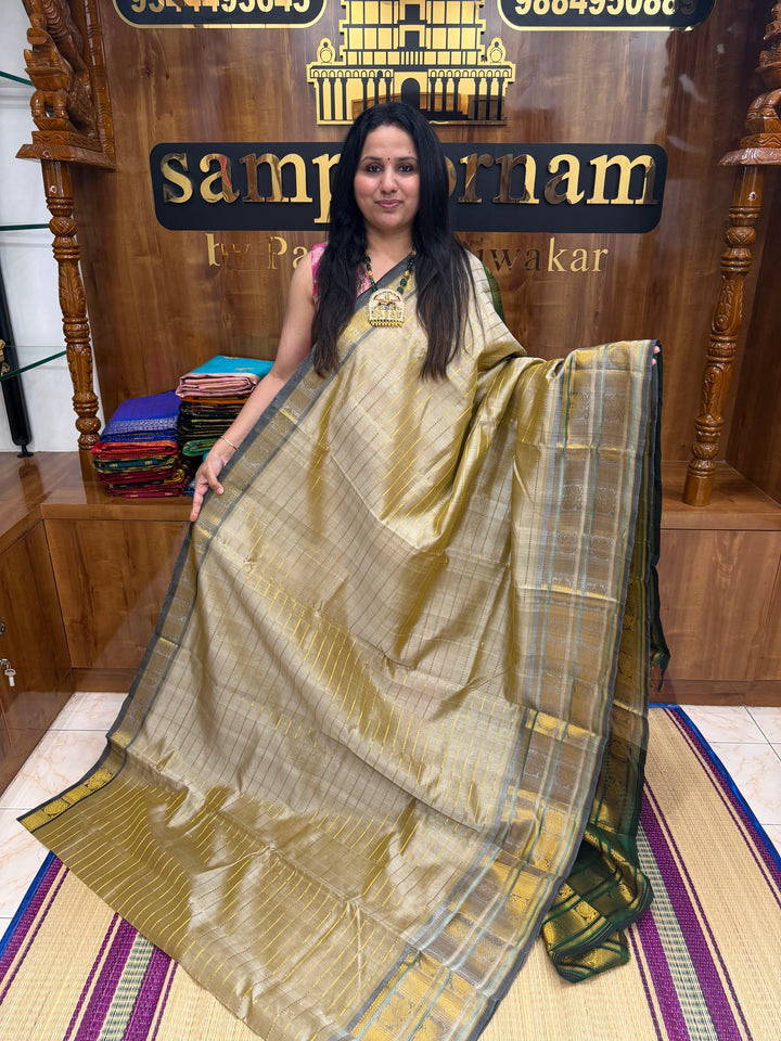 Cream with Green , Veldhari Zari Lines in the Body , Traditional Kanchi border , Rich Pallu , Pure Silk Cotton Saree