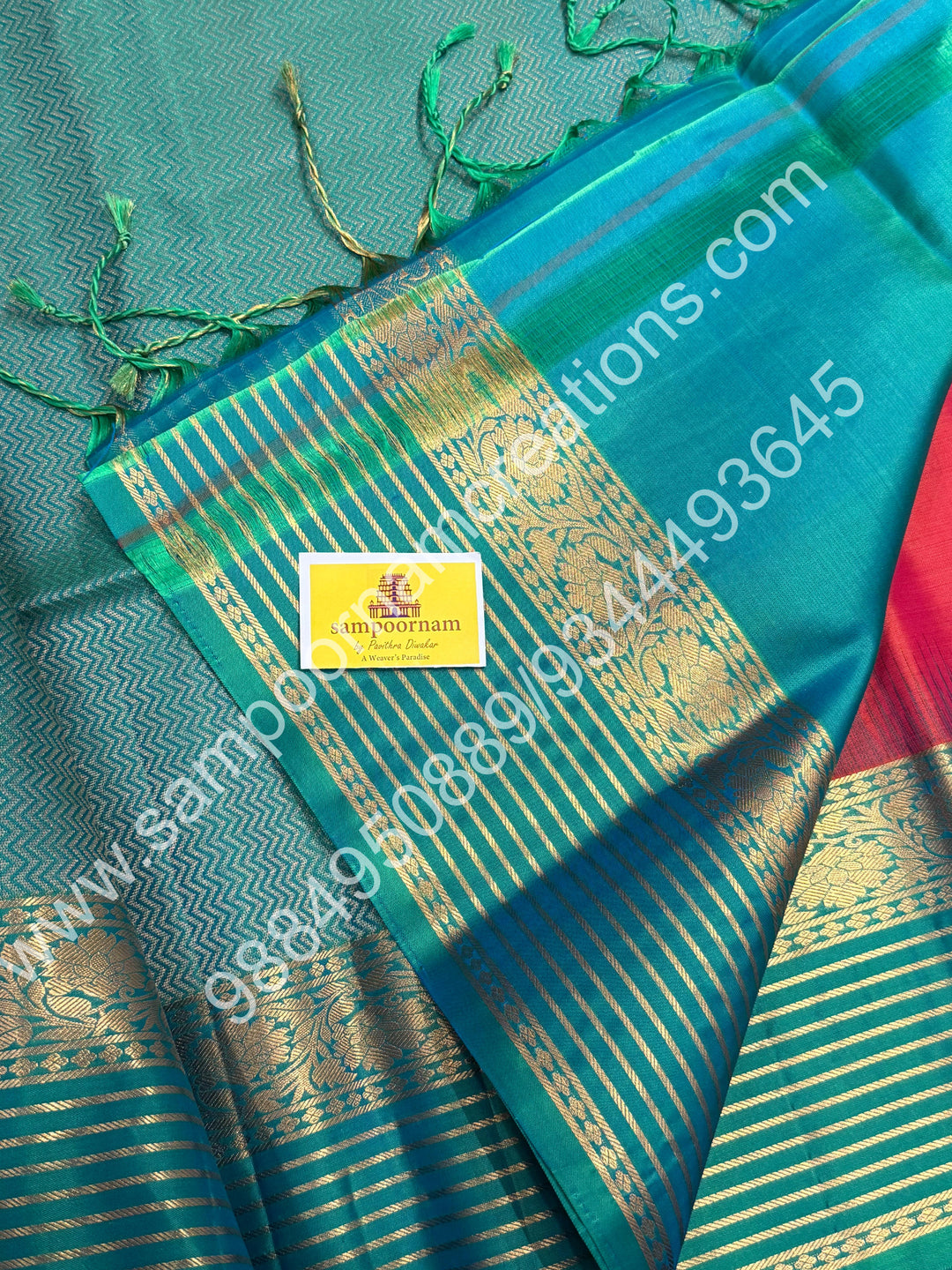 Orangish Red with Turquoise Blue, Rich Zari Butta in the Body, Retappet Veldhari Zari lines in the Border and Grand Pallu , Pure Soft Silk Saree