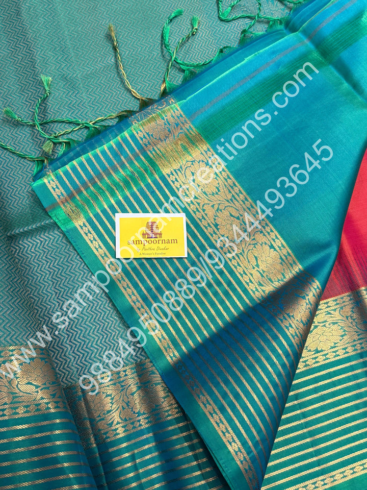 Orangish Red with Turquoise Blue, Rich Zari Butta in the Body, Retappet Veldhari Zari lines in the Border and Grand Pallu , Pure Soft Silk Saree