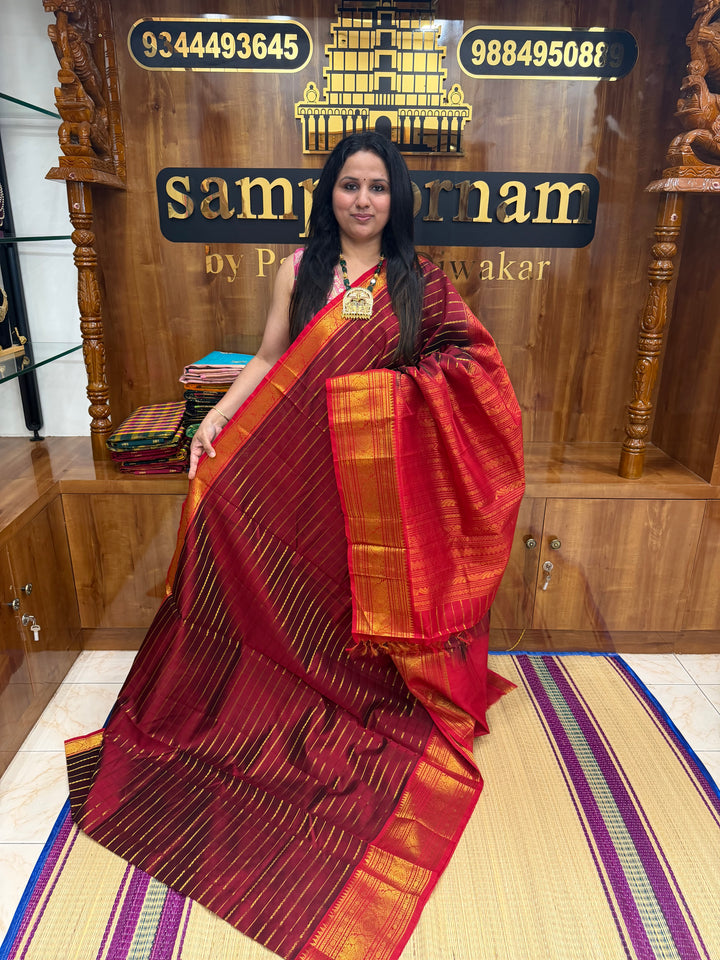 Dark Maroon with Red , Veldhari Zari Lines in the Body , Traditional Kanchi border , Rich Pallu , Pure Silk Cotton Saree