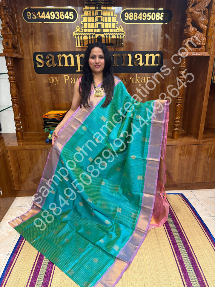 Double Shaded Sea Green with Baby Pink  , Rich Mayil and Chakram butta in the body with Zari Checks , Traditional borders and Rich Pallu Pure Silk Cotton Saree