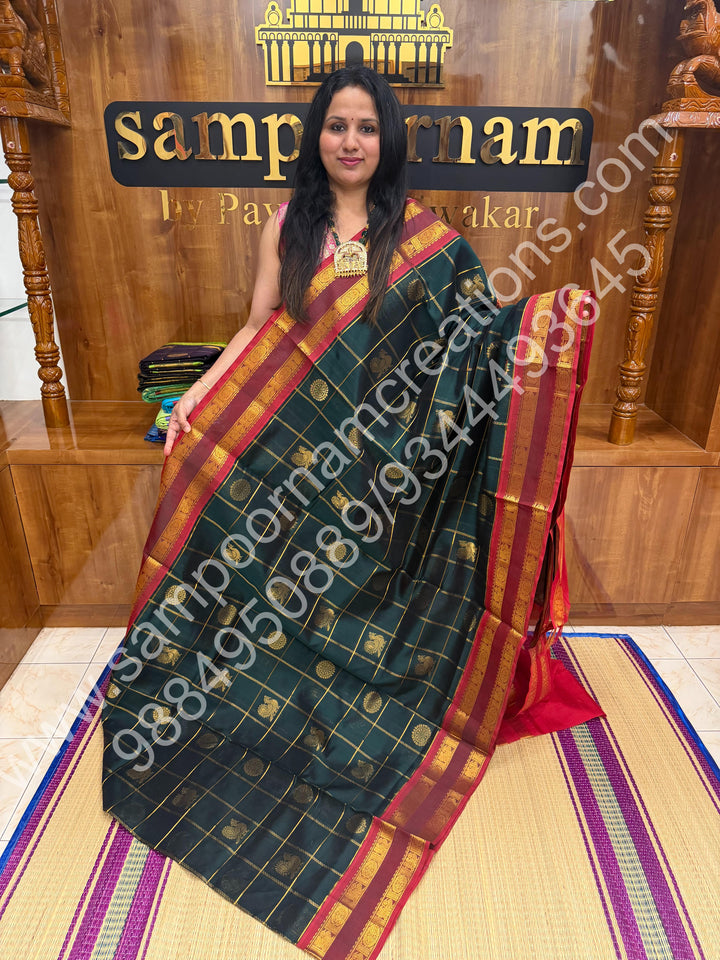 Bottle Green with Red  , Rich Mayil and Chakram butta in the body with Zari Checks , Traditional borders and Rich Pallu Pure Silk Cotton Saree