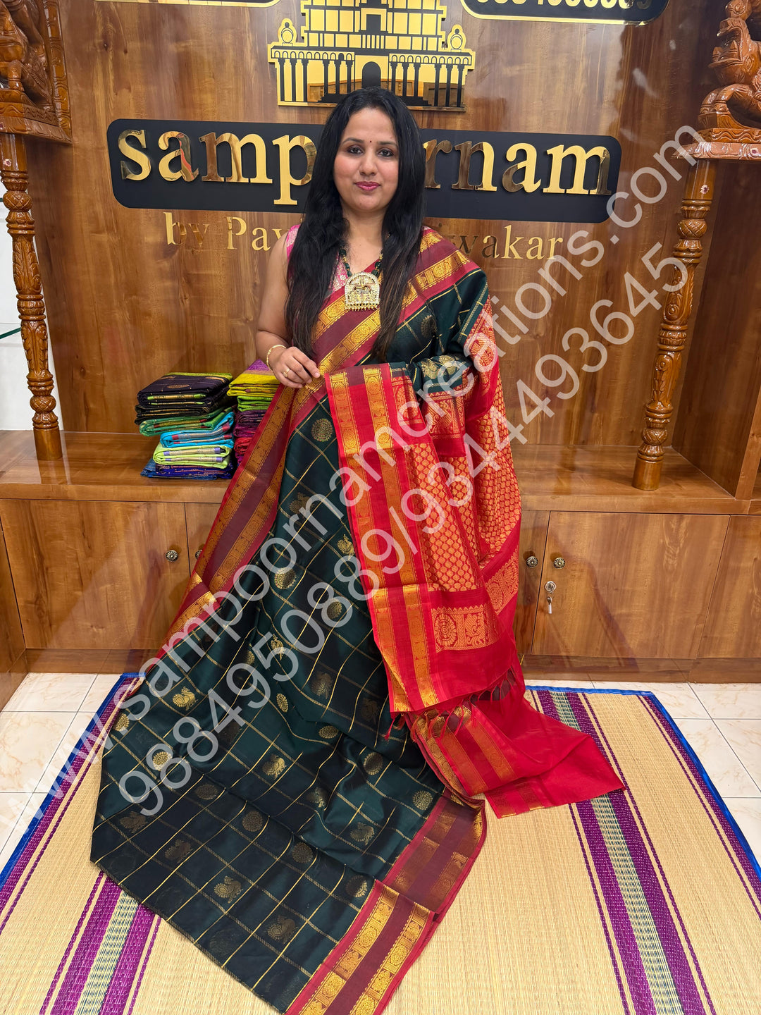 Bottle Green with Red  , Rich Mayil and Chakram butta in the body with Zari Checks , Traditional borders and Rich Pallu Pure Silk Cotton Saree