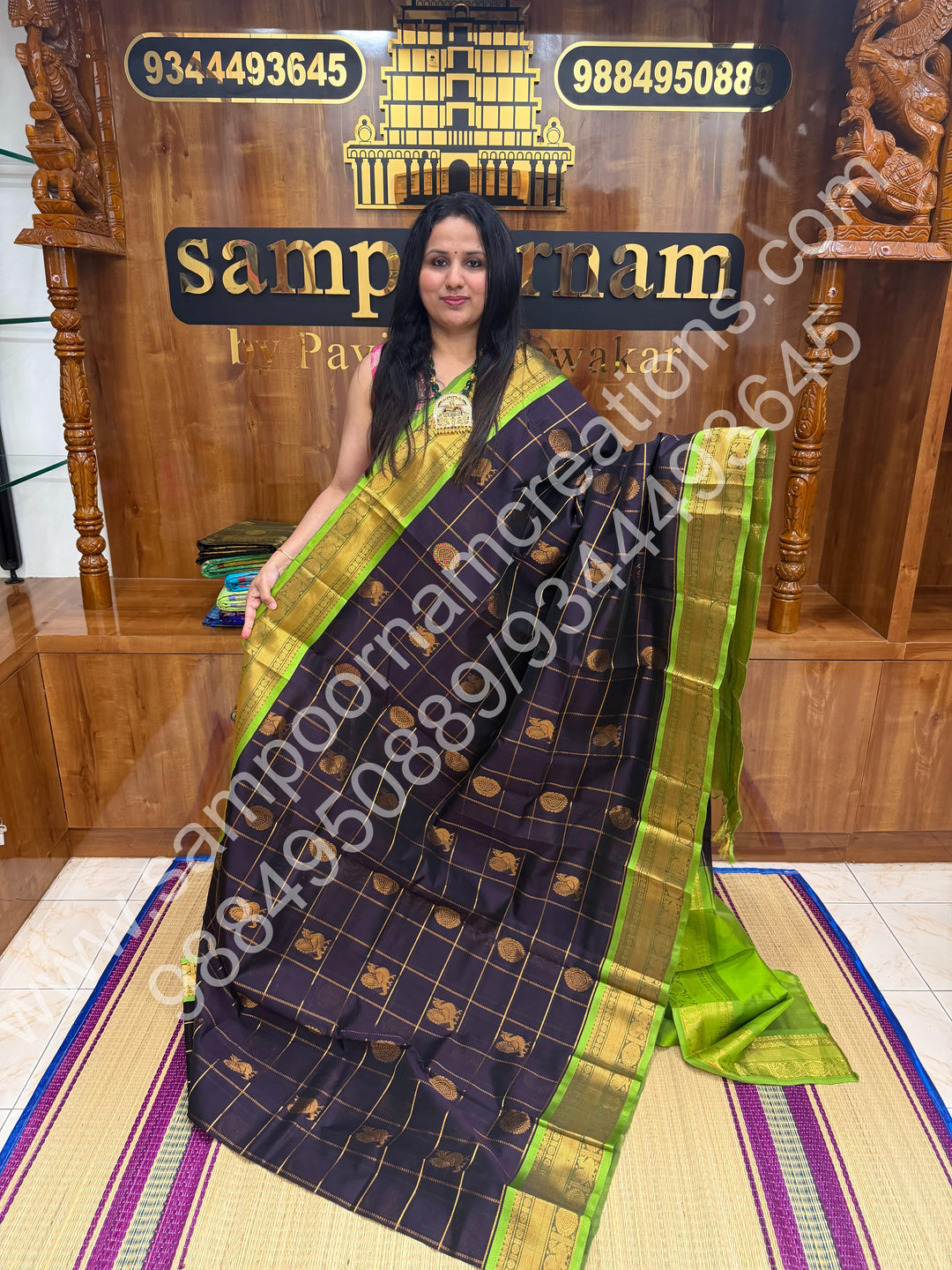 Dark Blue with parrot Green  , Rich Mayil and Chakram butta in the body with Zari Checks , Traditional borders and Rich Pallu Pure Silk Cotton Saree