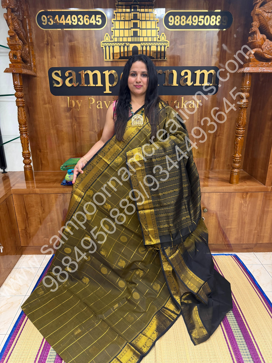 Sage Green with Black , Rich Mayil and Chakram butta in the body with Zari Checks , Traditional borders and Rich Pallu Pure Silk Cotton Saree