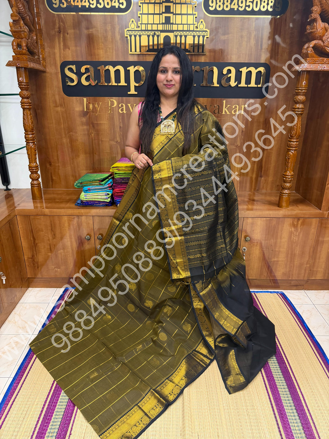 Sage Green with Black , Rich Mayil and Chakram butta in the body with Zari Checks , Traditional borders and Rich Pallu Pure Silk Cotton Saree