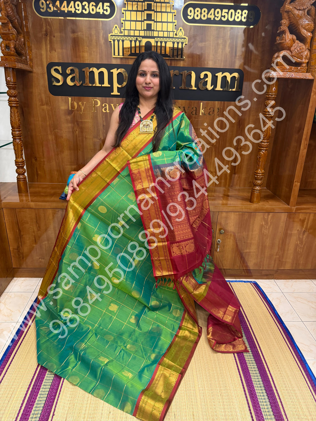 Double Shaded Rexona Green with Maroon  , Rich Mayil and Chakram butta in the body with Zari Checks , Traditional borders and Rich Pallu Pure Silk Cotton Saree