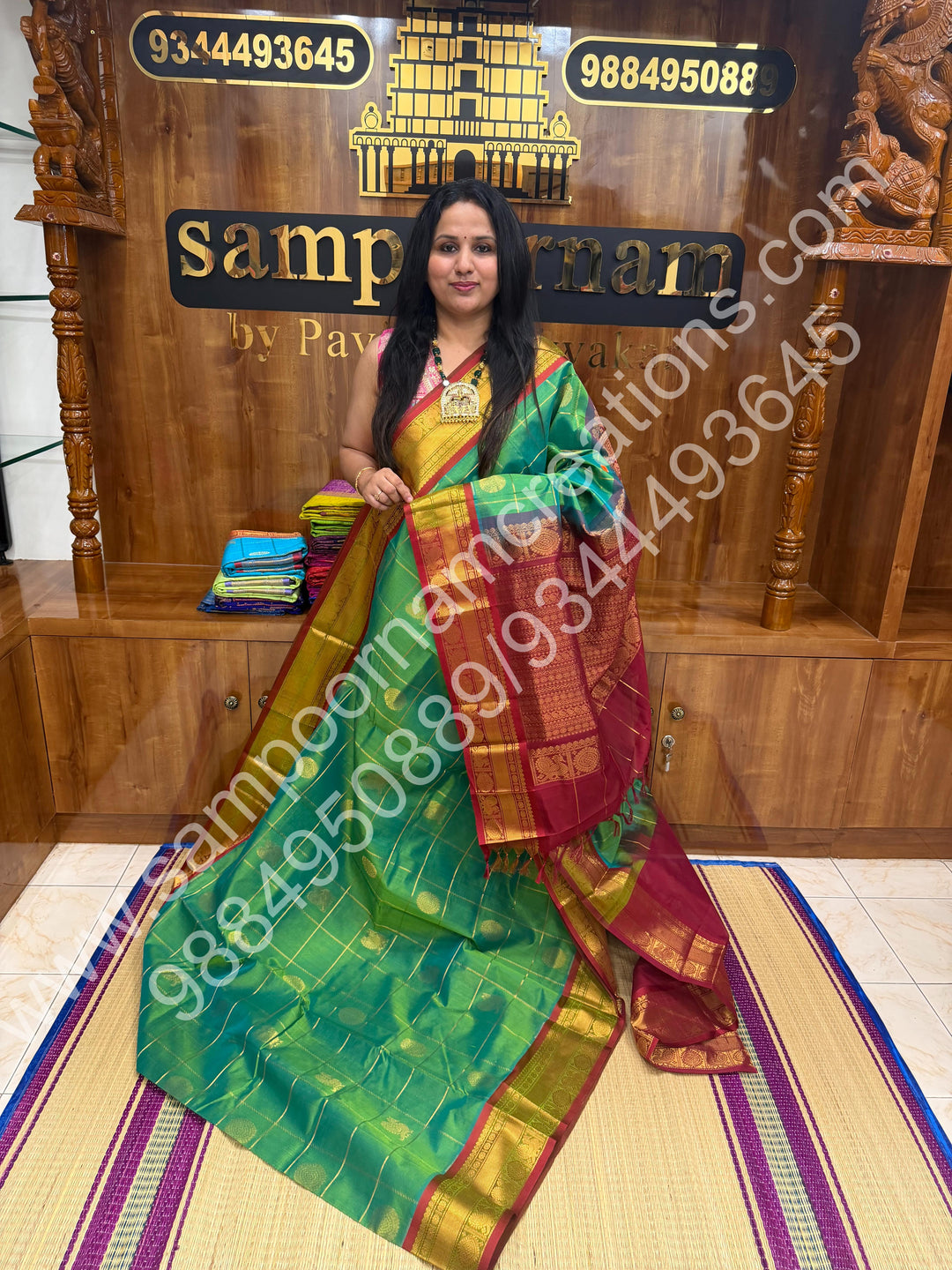 Double Shaded Rexona Green with Maroon  , Rich Mayil and Chakram butta in the body with Zari Checks , Traditional borders and Rich Pallu Pure Silk Cotton Saree