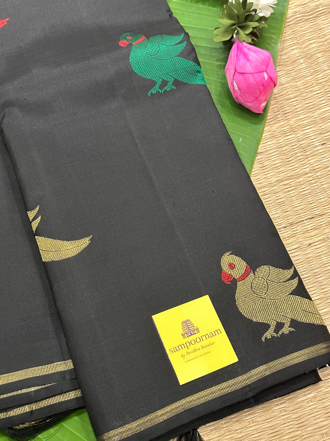 A Classic Black Saree with Kalakshetra Kili Butta in the body and Palla , with green and red thread work and gold Zari work, Rich Pallu Pure Kanjivaram Silk Saree