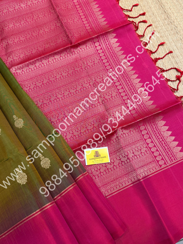 Mehandi green with Dark Pink ,Rich Zari Butta in the body , Simple Borders and Grand Pallu , Pure Soft Silk Saree