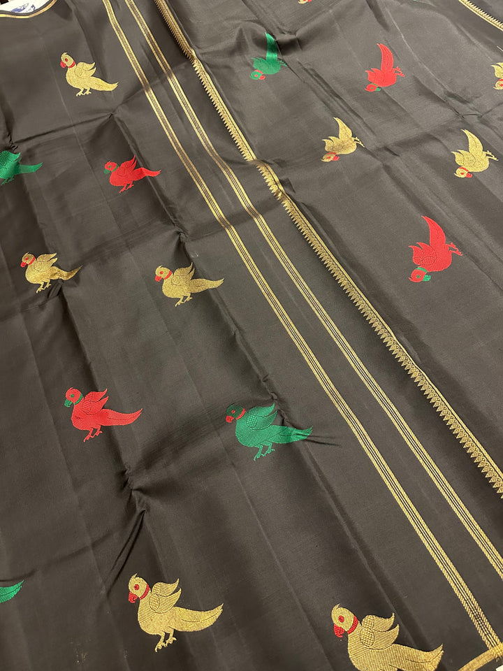 A Classic Black Saree with Kalakshetra Kili Butta in the body and Palla , with green and red thread work and gold Zari work, Rich Pallu Pure Kanjivaram Silk Saree