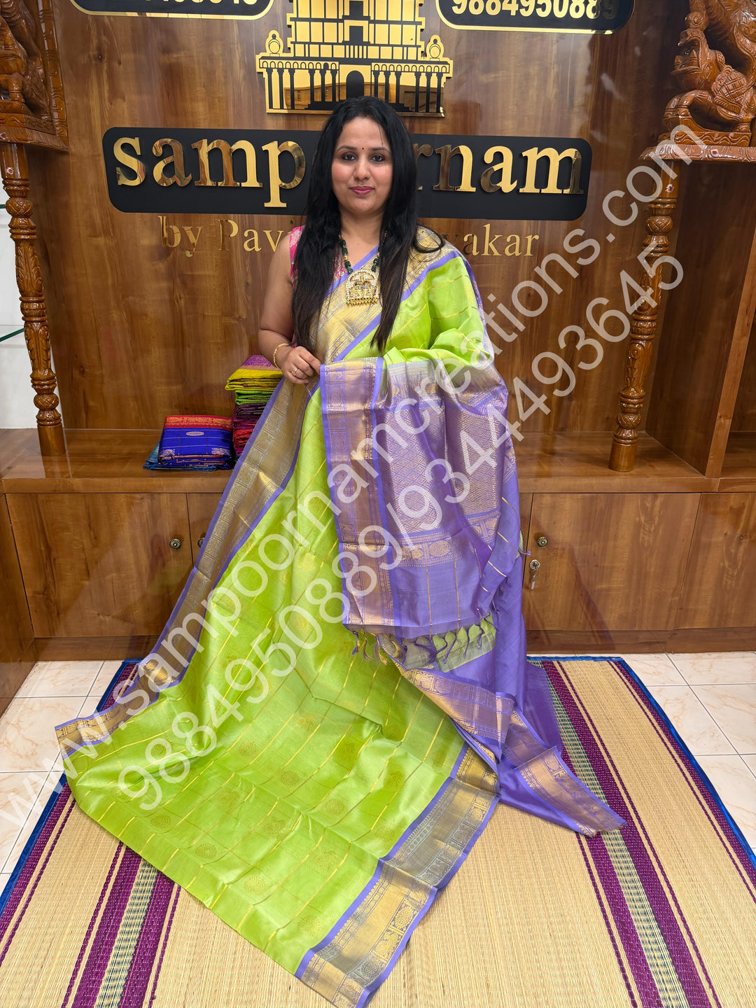 Pastel Green with Lavender  , Rich Mayil and Chakram butta in the body with Zari Checks , Traditional borders and Rich Pallu Pure Silk Cotton Saree
