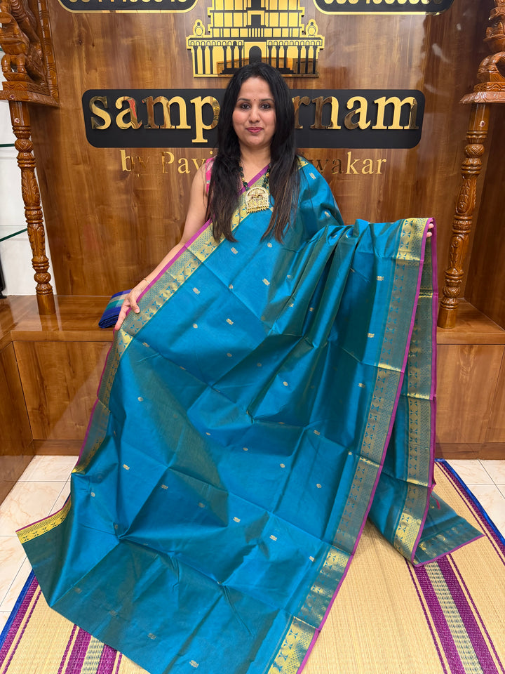 Double Shaded Chinthamani Blue , Pink Selvedge Vairaoosi Zari lines with Rich Annam and Rudraksh  Zari Butta in the body , traditional borders and Rich Pallu Pure Silk Cotton Saree