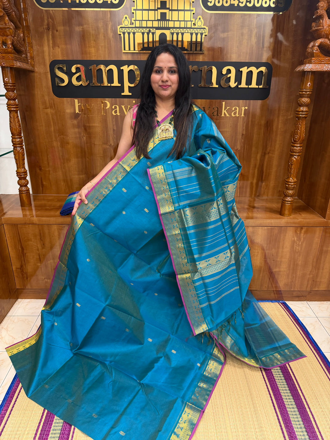 Double Shaded Chinthamani Blue , Pink Selvedge Vairaoosi Zari lines with Rich Annam and Rudraksh  Zari Butta in the body , traditional borders and Rich Pallu Pure Silk Cotton Saree