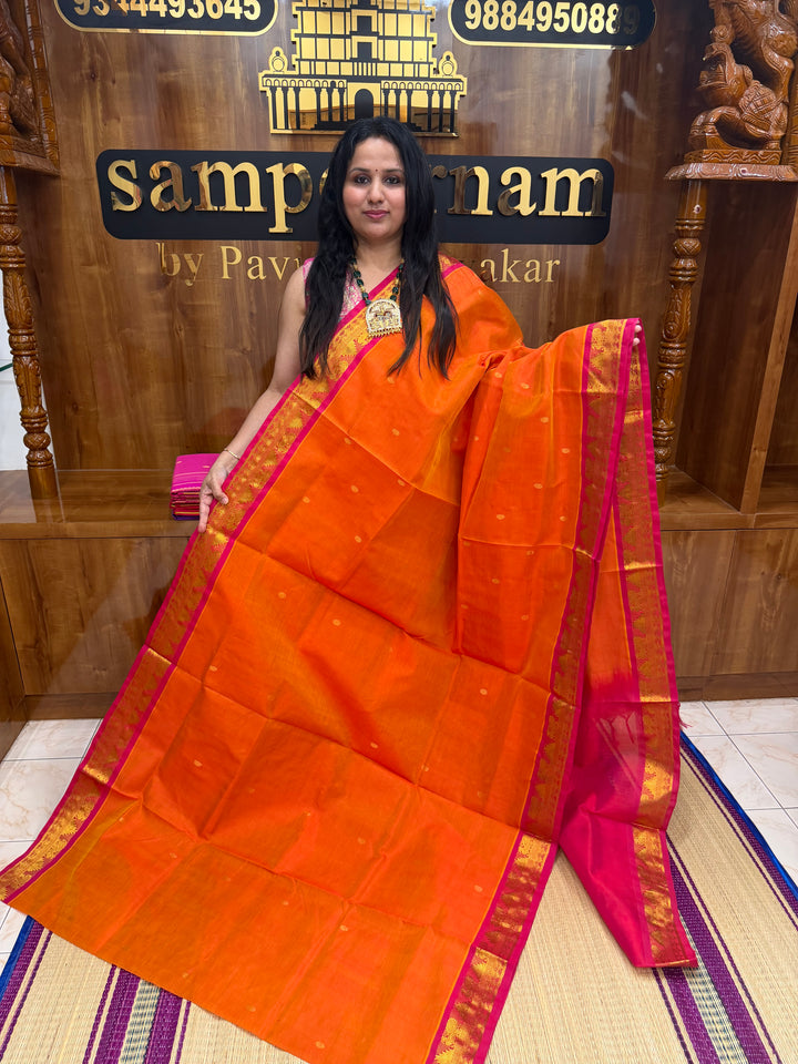 Sunset Orange with Red  ,  Rich  Zari Butta in the body , traditional borders and Rich Pallu Pure Silk Cotton Saree