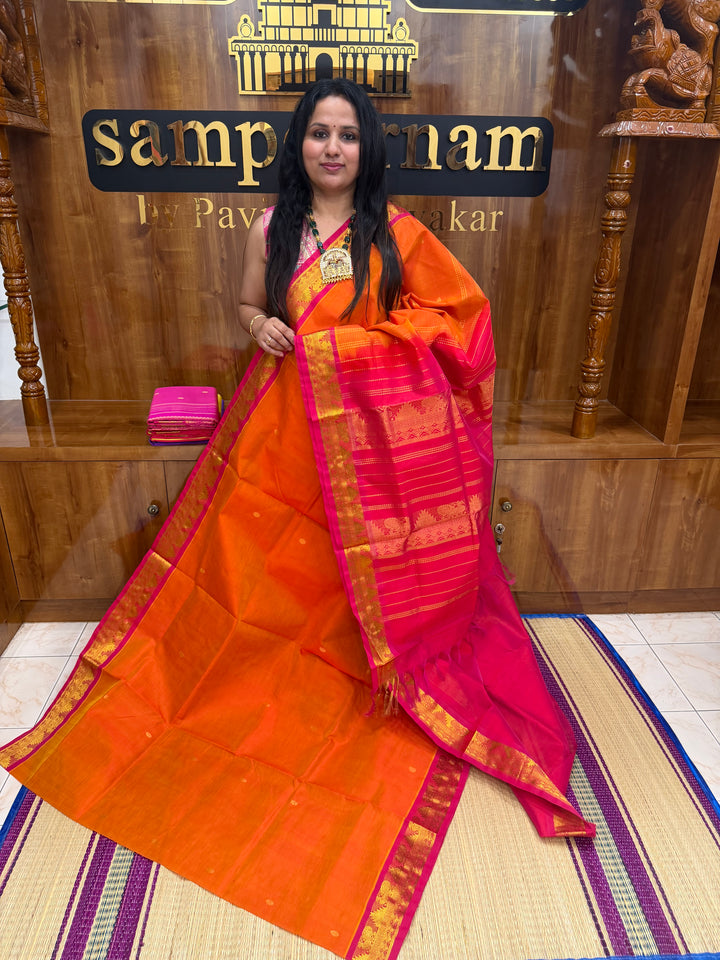Sunset Orange with Red  ,  Rich  Zari Butta in the body , traditional borders and Rich Pallu Pure Silk Cotton Saree