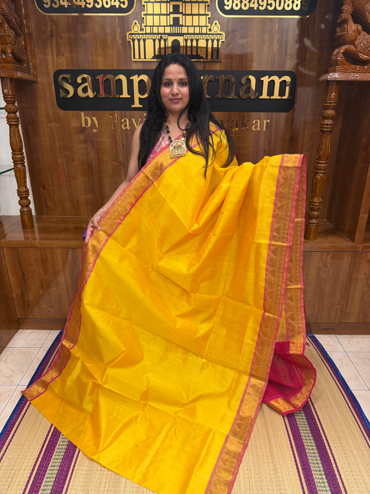 Manjal with Red ,  Rich  Zari Butta in the body , traditional borders and Rich Pallu Pure Silk Cotton Saree