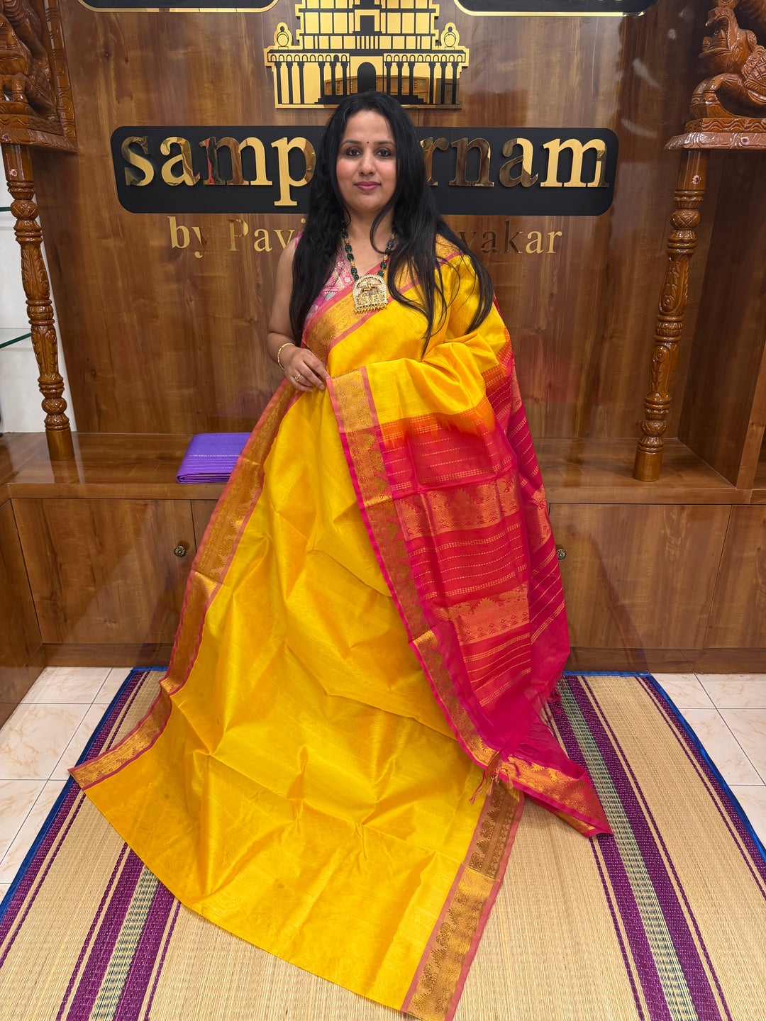 Manjal with Red ,  Rich  Zari Butta in the body , traditional borders and Rich Pallu Pure Silk Cotton Saree