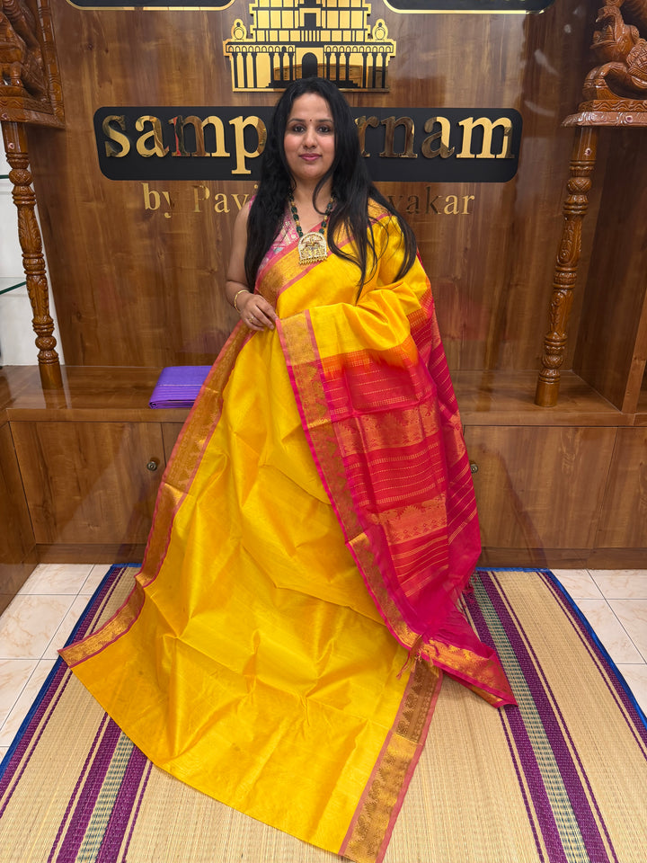 Manjal with Red ,  Rich  Zari Butta in the body , traditional borders and Rich Pallu Pure Silk Cotton Saree