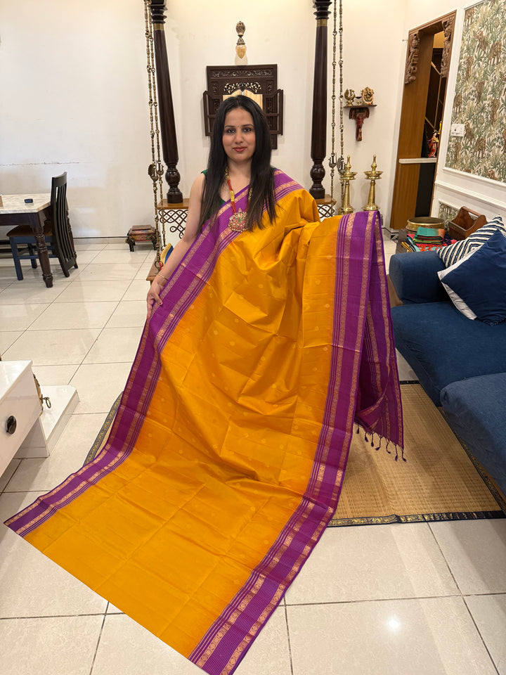 A classic Manjal with Purple, Rich Butta in the Body, Rettapet Traditional Borders and Grand Pallu Pure Soft Silk Saree