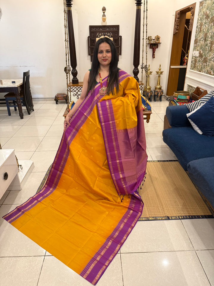 A classic Manjal with Purple, Rich Butta in the Body, Rettapet Traditional Borders and Grand Pallu Pure Soft Silk Saree