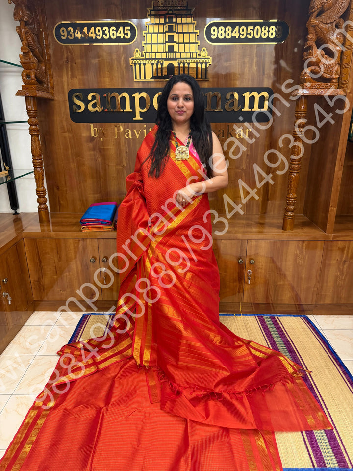 Rust Orange , Zari checks  in the body  , Rettapet  border and Rich Pallu , 10 Yards  Pure Silk Cotton Saree